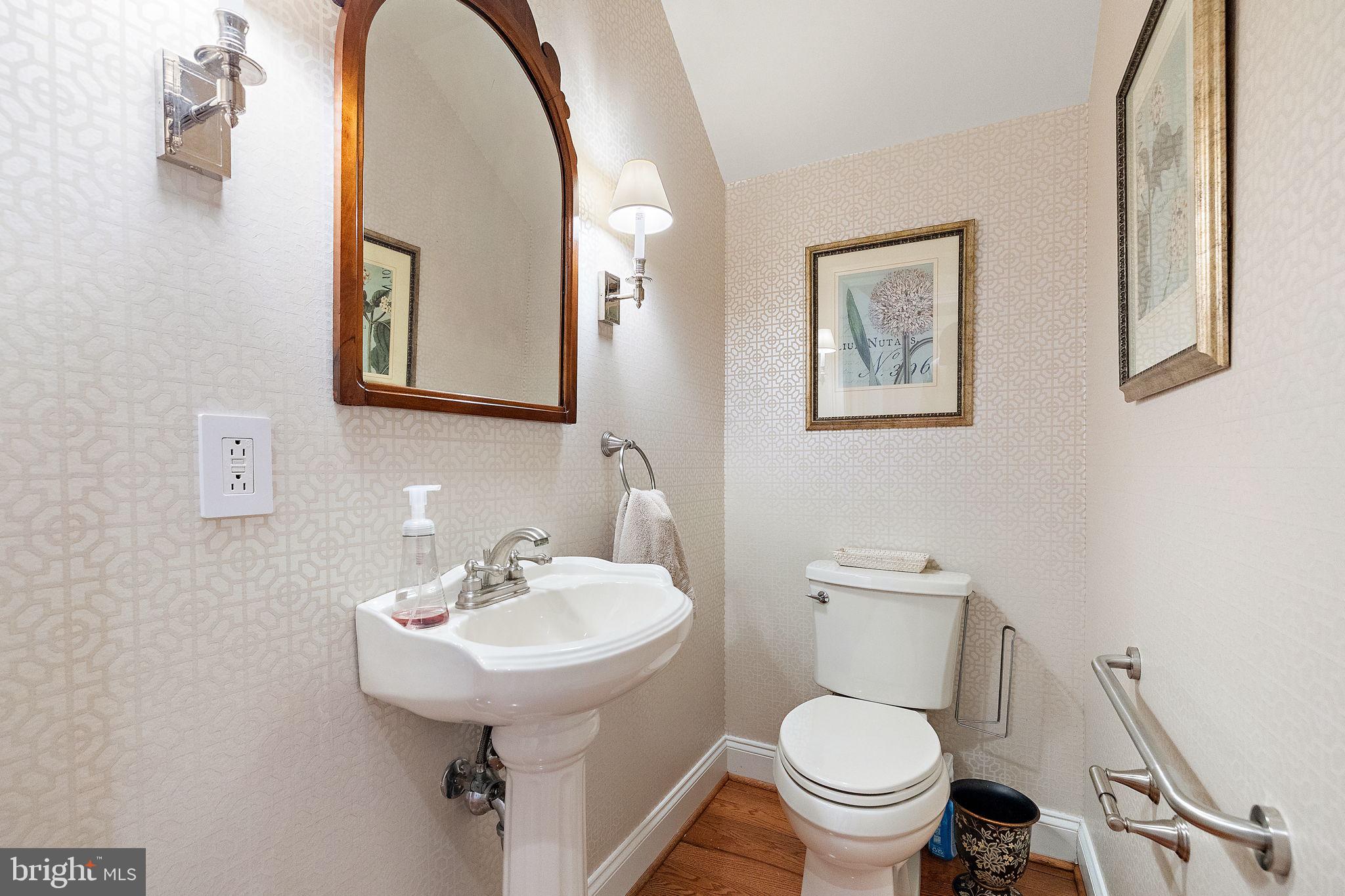 120 Bancroft Mills Road Wilmington, DE 19806 - Photo 18 of 34 a bathroom with a toilet a sink and mirror