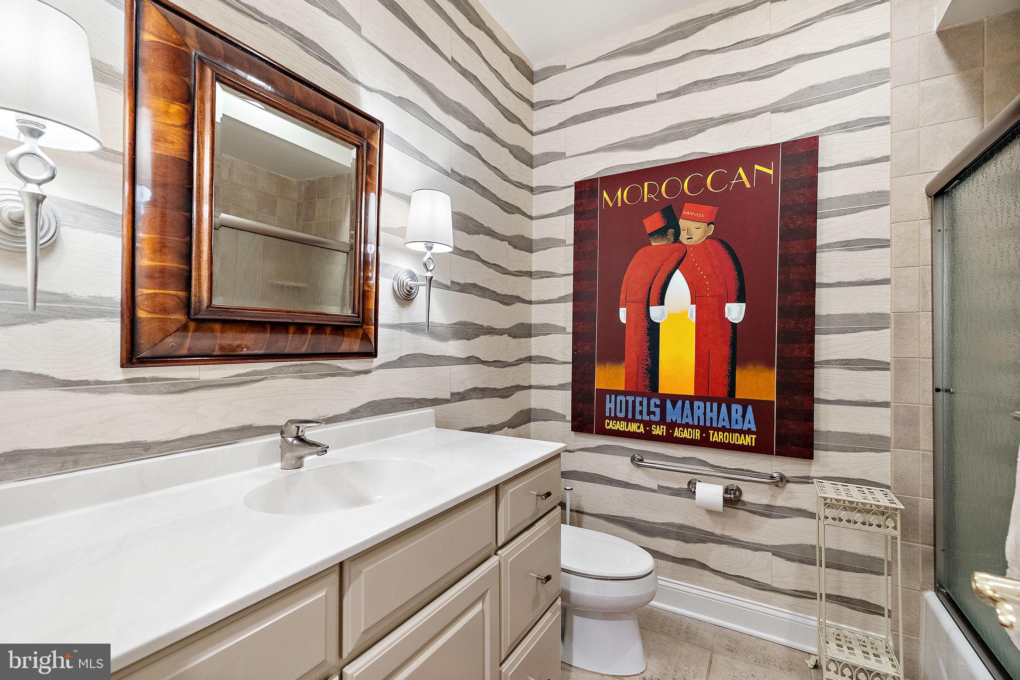 120 Bancroft Mills Road Wilmington, DE 19806 - Photo 23 of 34 a bathroom with a sink a mirror and a toilet