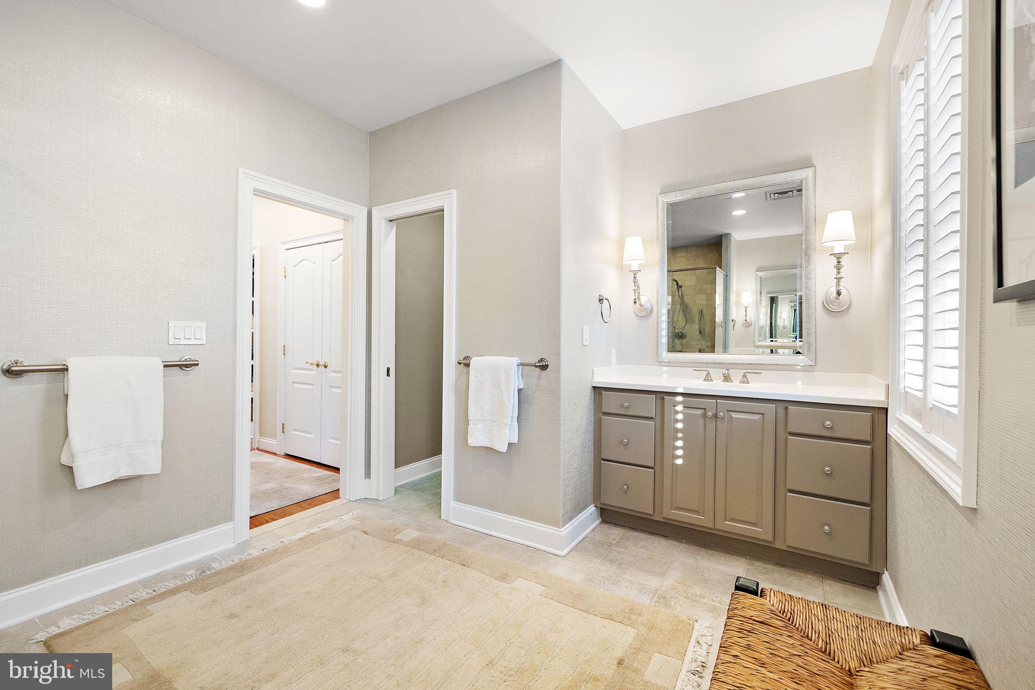 120 Bancroft Mills Road Wilmington, DE 19806 - Photo 30 of 34 a spacious bathroom with a shower a sink and a mirror