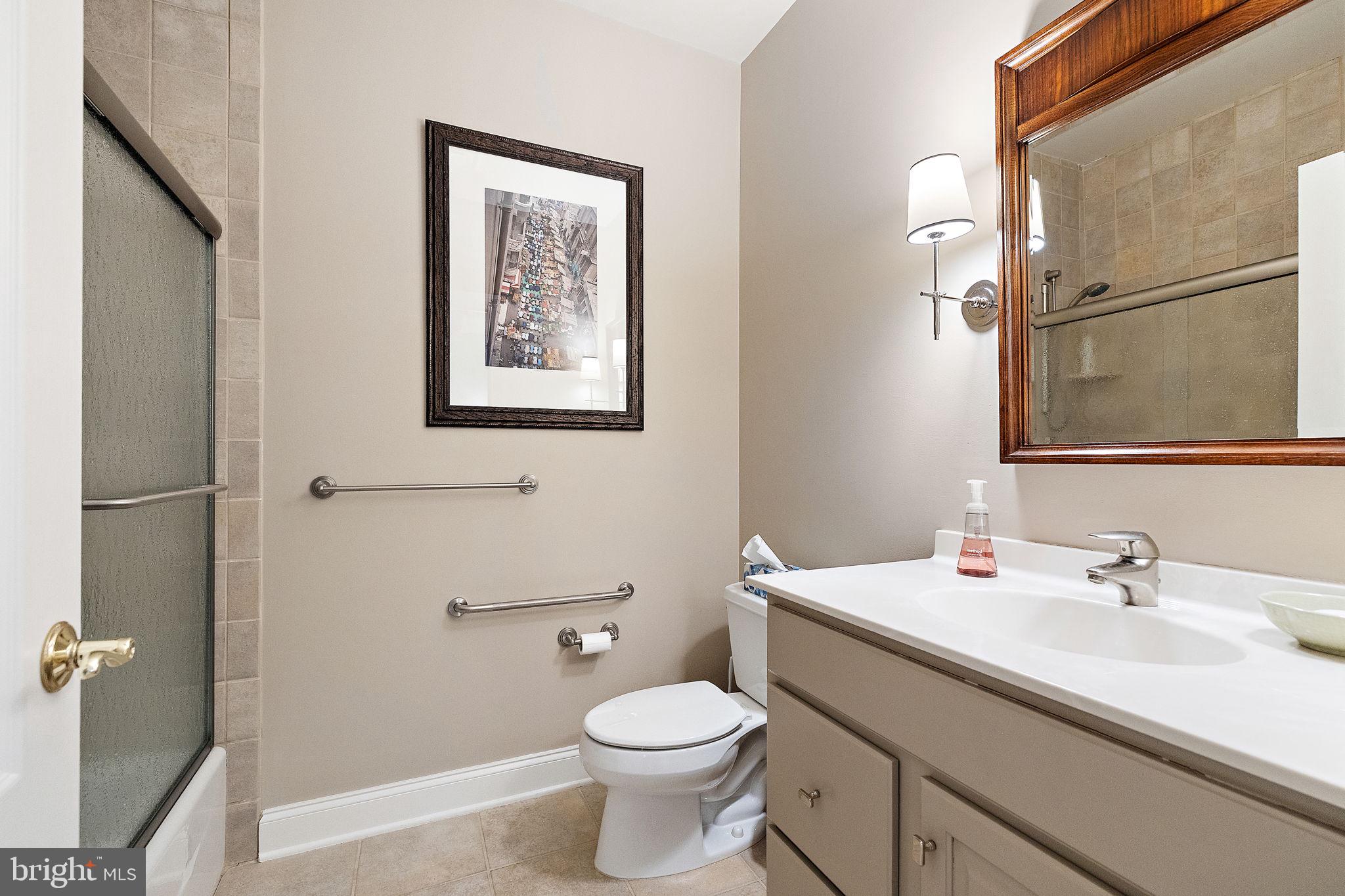 120 Bancroft Mills Road Wilmington, DE 19806 - Photo 33 of 34 a bathroom with a toilet sink and mirror