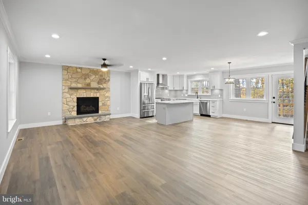 a view of kitchen with furniture and wooden floor