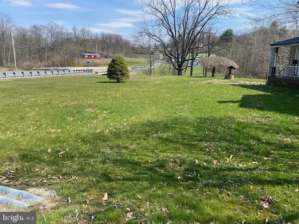 a kitchen with a sink a stove and cabinets