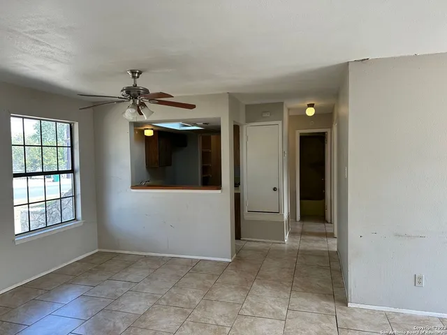 a bathroom with a glass door shower and vanity