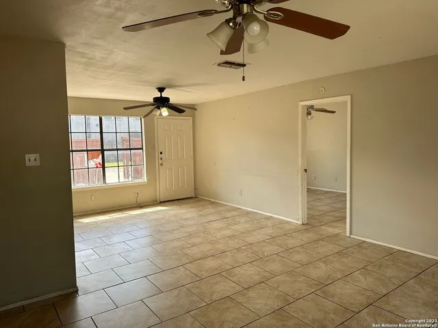 a bathroom with a toilet and shower