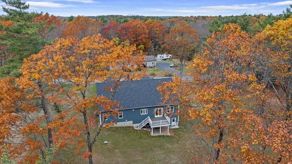 an aerial view of a house with a lake view