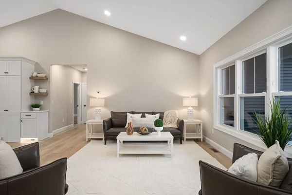 a living room with furniture and a large window