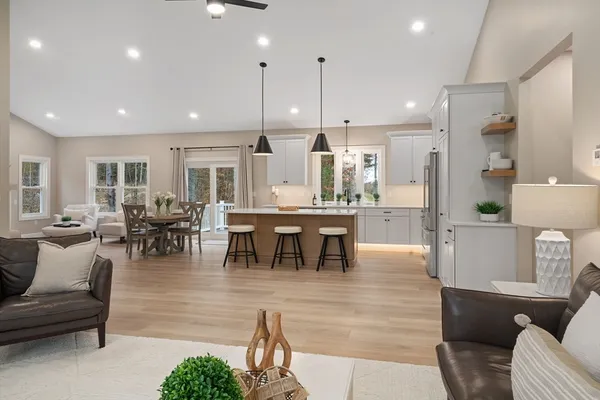 a large kitchen with a table and chairs