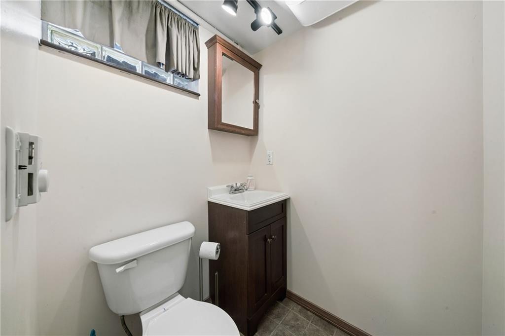 711 Jane Street Pittsburgh, PA 15239 - Photo 20 of 27 Conveniently located downstairs half bathroom off of family room.