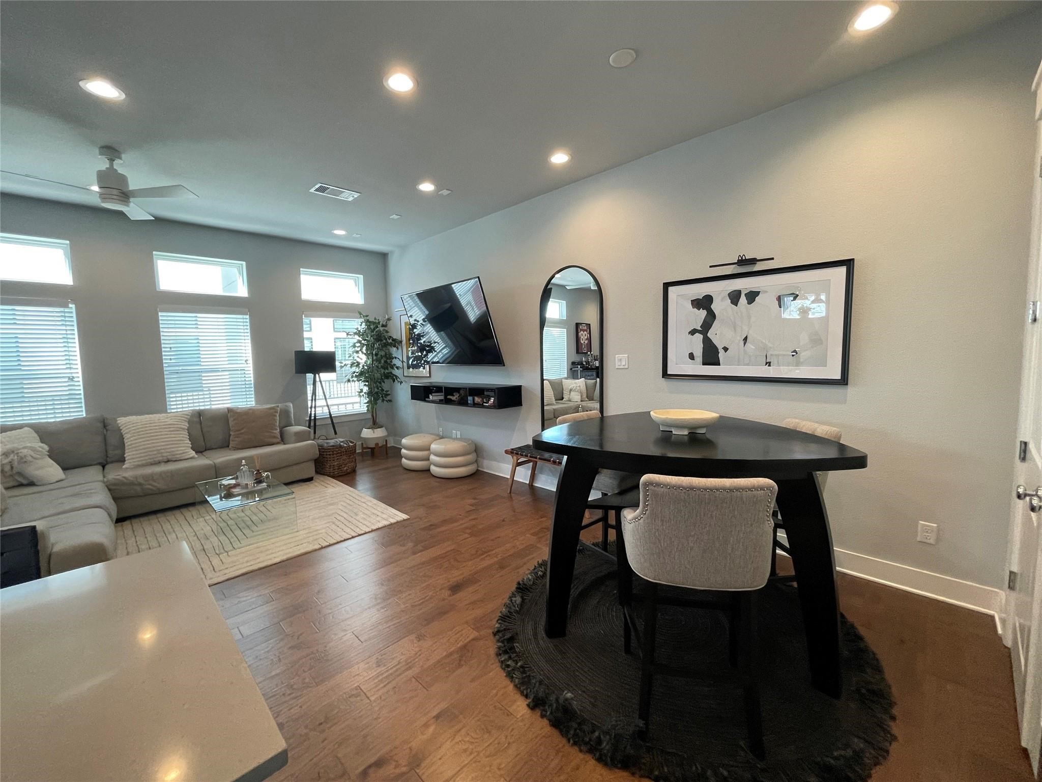 902 Martin Street, Unit A Houston, TX 77018 - Photo 9 of 21 a living room with furniture a large window and wood floor