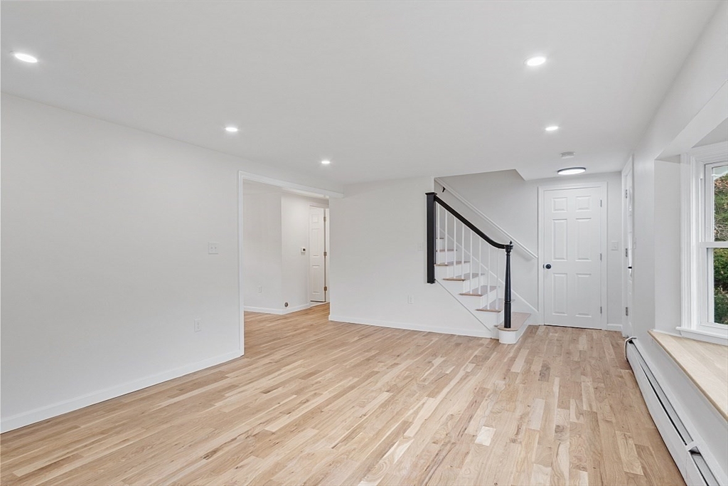 31 Pine Hill Road Chelmsford, MA 01824 - Photo 11 of 42 a view of empty room with wooden floor and fan