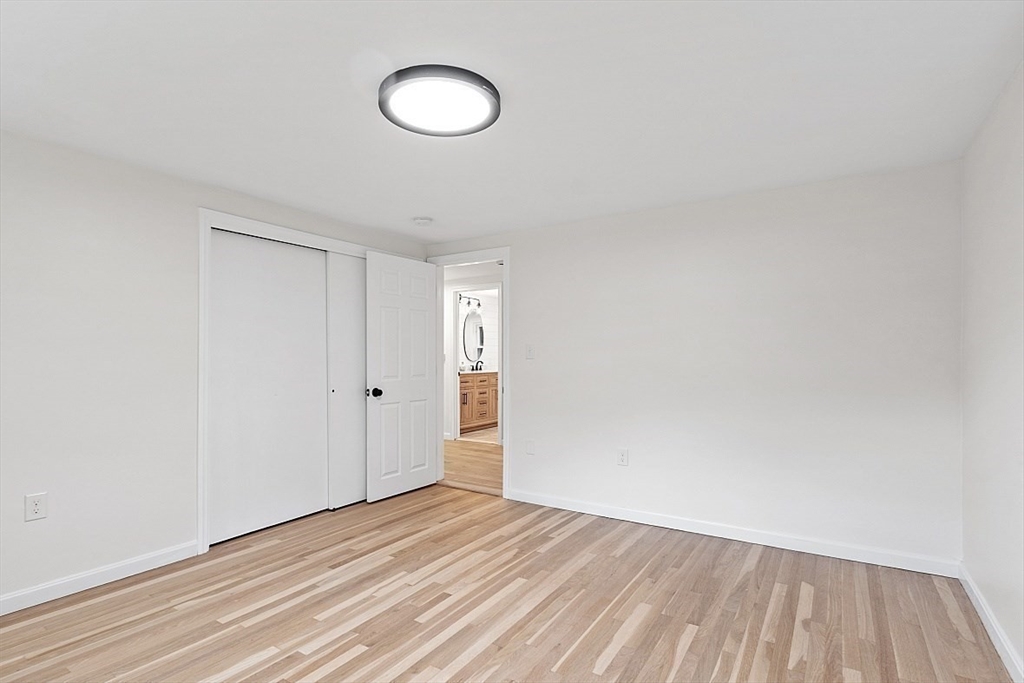 31 Pine Hill Road Chelmsford, MA 01824 - Photo 20 of 42 a view of a room with wooden floor and white wall