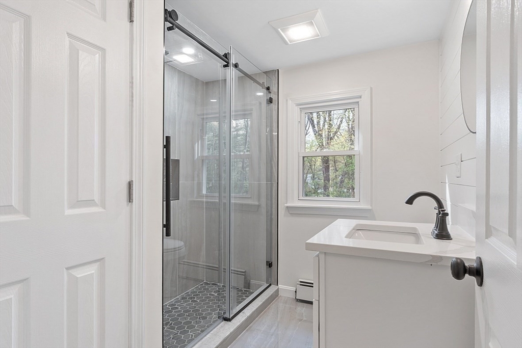 31 Pine Hill Road Chelmsford, MA 01824 - Photo 26 of 42 a bathroom with a shower and a sink