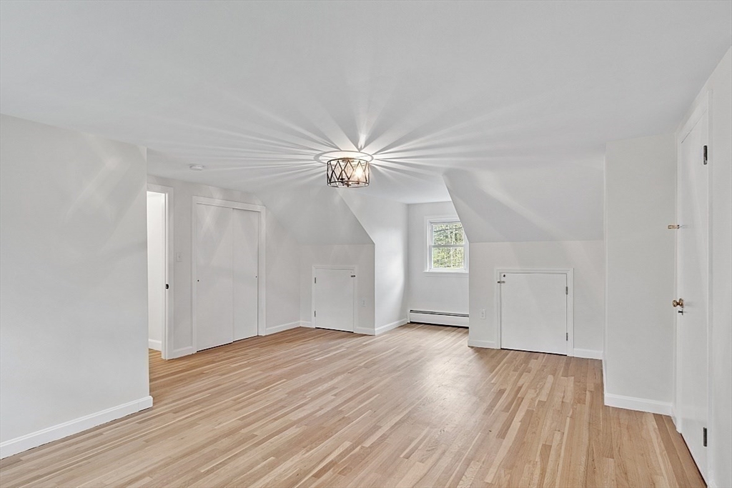 31 Pine Hill Road Chelmsford, MA 01824 - Photo 29 of 42 a view of a room with wooden floor and white walls