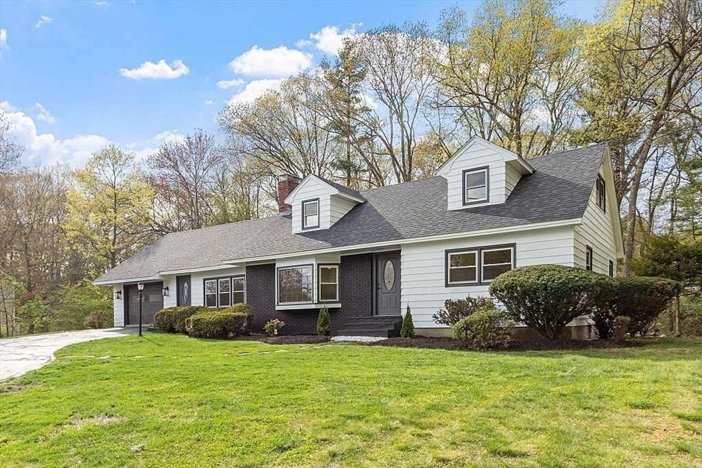 31 Pine Hill Road Chelmsford, MA 01824 - Photo 3 of 42 a front view of a house with a garden