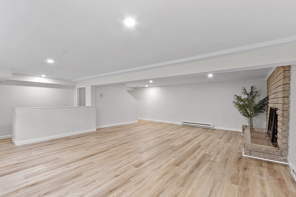 31 Pine Hill Road Chelmsford, MA 01824 - Photo 33 of 42 a view of empty room with wooden floor and a potted plant