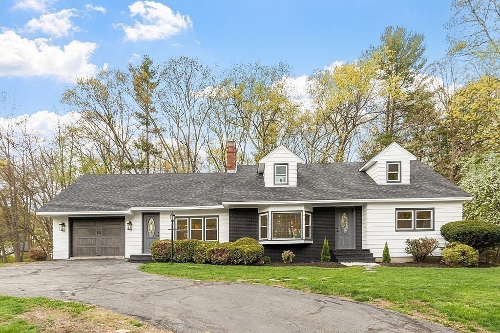 31 Pine Hill Road Chelmsford, MA 01824 - Photo 36 of 42 a front view of a house with garden