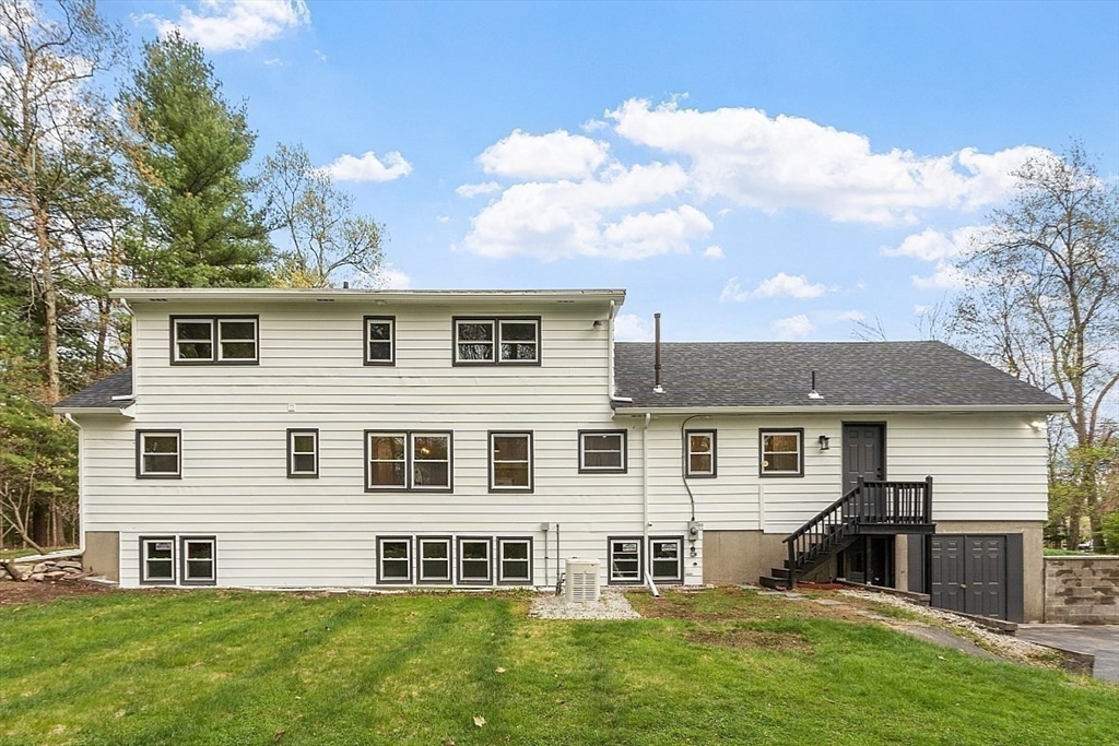 31 Pine Hill Road Chelmsford, MA 01824 - Photo 37 of 42 a front view of a house with a yard