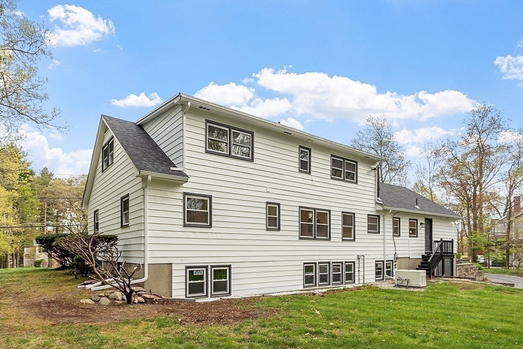 31 Pine Hill Road Chelmsford, MA 01824 - Photo 38 of 42 a front view of a house with a yard