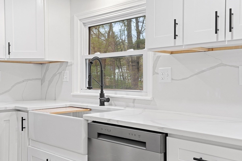 31 Pine Hill Road Chelmsford, MA 01824 - Photo 6 of 42 a kitchen with a sink and a window