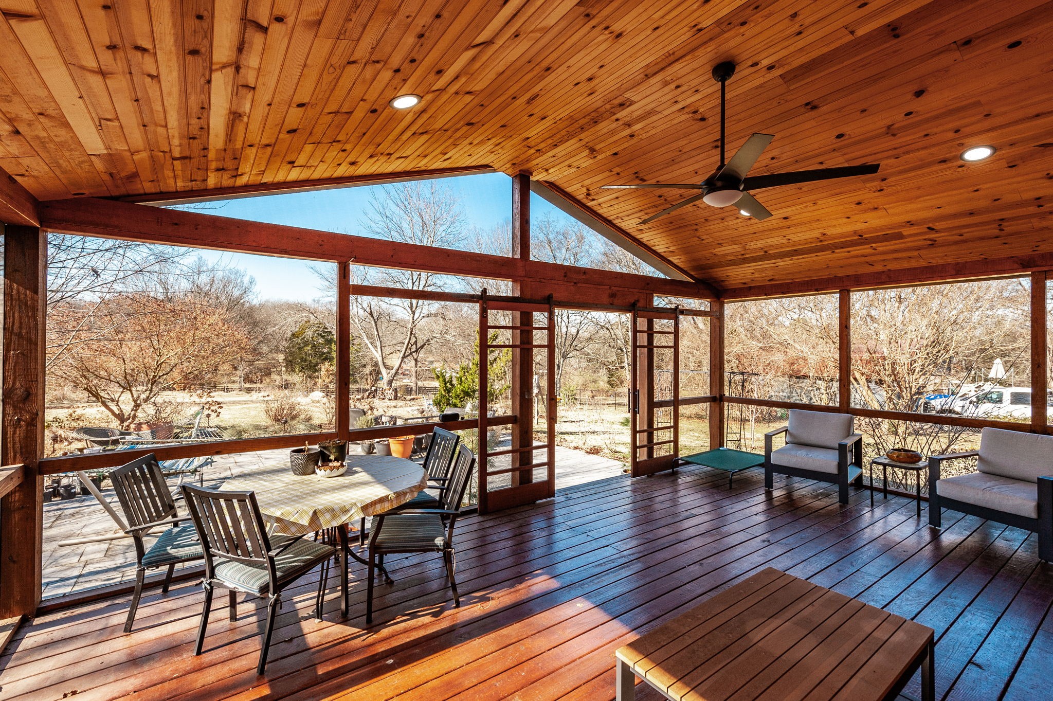 705 Ronnie Road Madison, TN 37115 - Photo 46 of 65 a porch with wooden floor outdoor seating and yard in the back