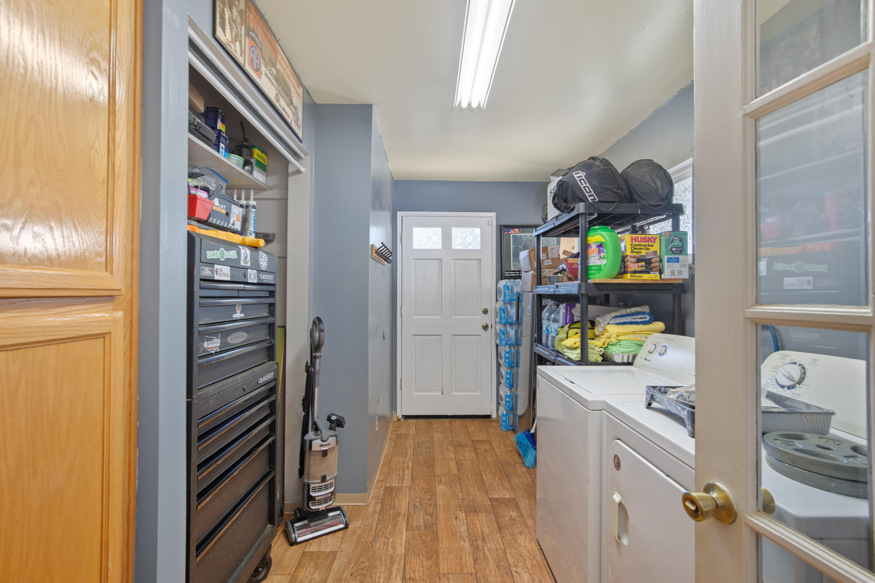 12748 Water Gap Road Williams, OR 97544 - Photo 7 of 35 a kitchen with stainless steel appliances a refrigerator and a stove top oven