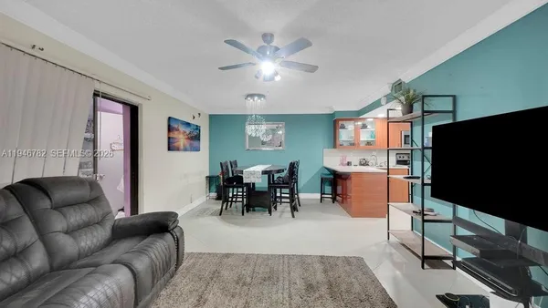 a living room with furniture and a flat screen tv