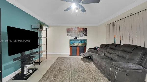 a living room with furniture and a flat screen tv