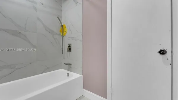 a bathroom with a sink and bathtub
