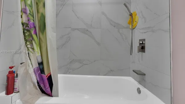 a bathroom with a bath tub