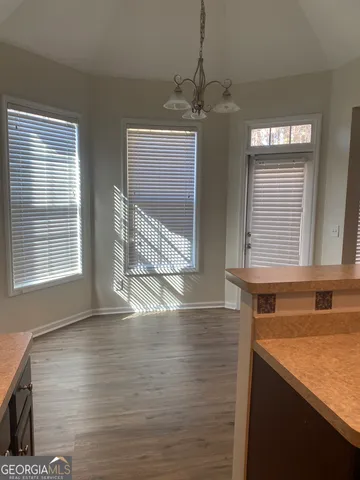 a view of a kitchen with a sink cabinets and a window