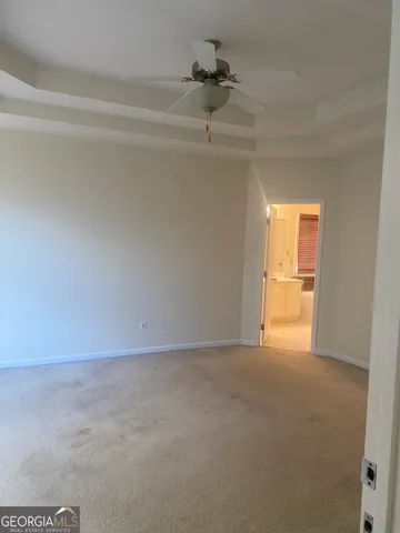 a view of an empty room and a window