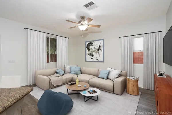 a living room with furniture and a large window