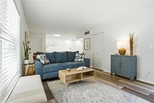 a living room with furniture and a rug