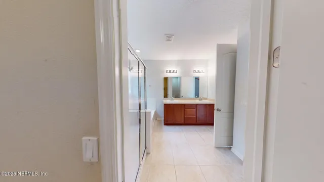 a view of room with a couch and cabinet