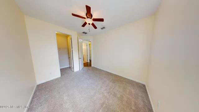 a view of a livingroom and a hallway