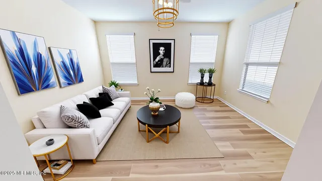 a spacious bedroom with a bed and a chandelier