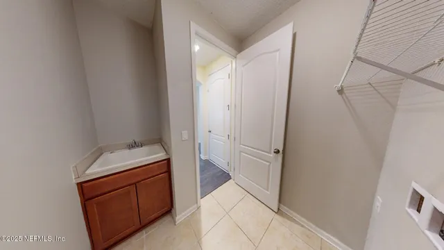 a room with a refrigerator and washer