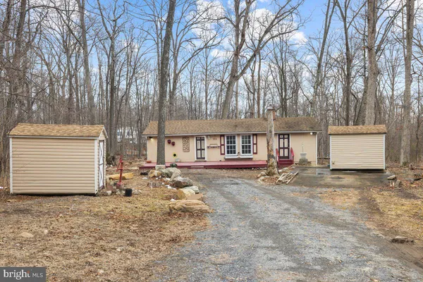 a view of a house with a yard and garage