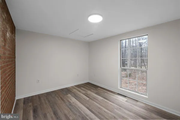 a bathroom with a sink toilet and a window