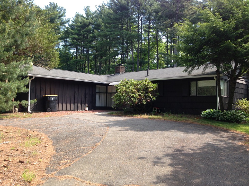 19 Clara Road Framingham, MA 01701 - Photo 2 of 13 a front view of a house with a yard and garage