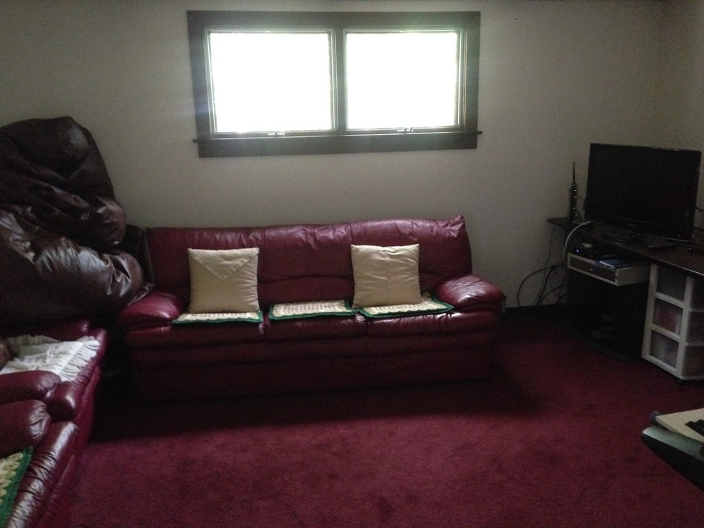 19 Clara Road Framingham, MA 01701 - Photo 5 of 13 a living room with furniture a flat screen tv and a window