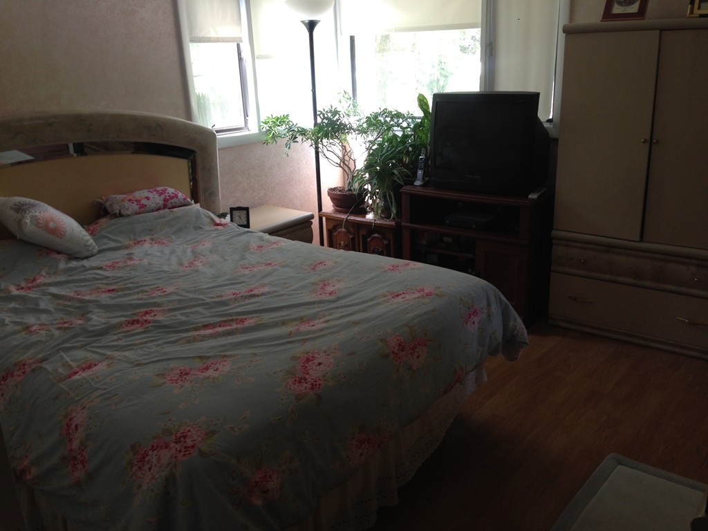 19 Clara Road Framingham, MA 01701 - Photo 9 of 13 a bedroom with a bed and a television