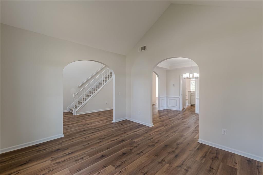775 Southland Pass Stone Mountain, GA 30087 - Photo 15 of 76 a view of an empty room with wooden floor