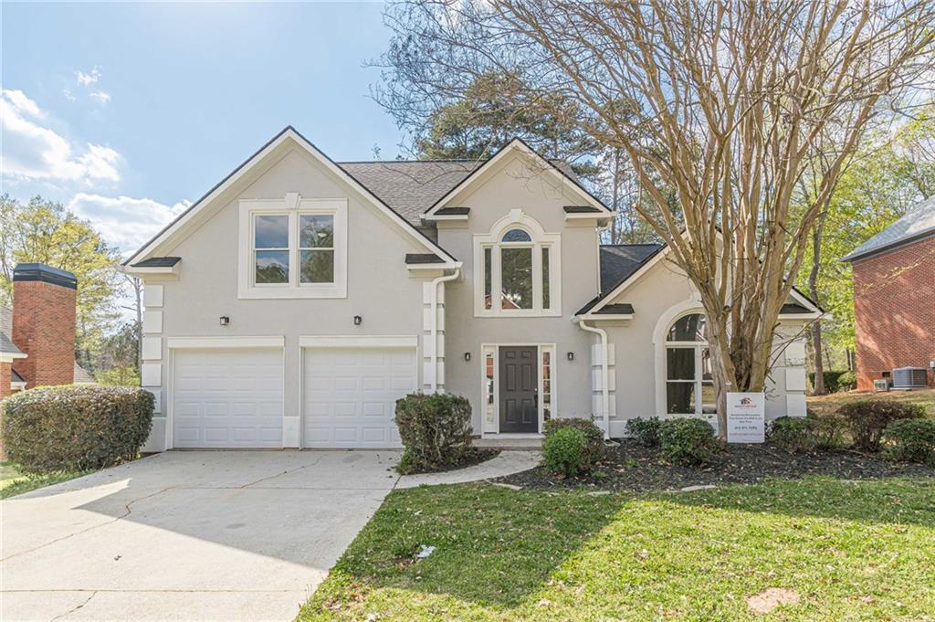 775 Southland Pass Stone Mountain, GA 30087 - Photo 2 of 76 a view of house with a yard