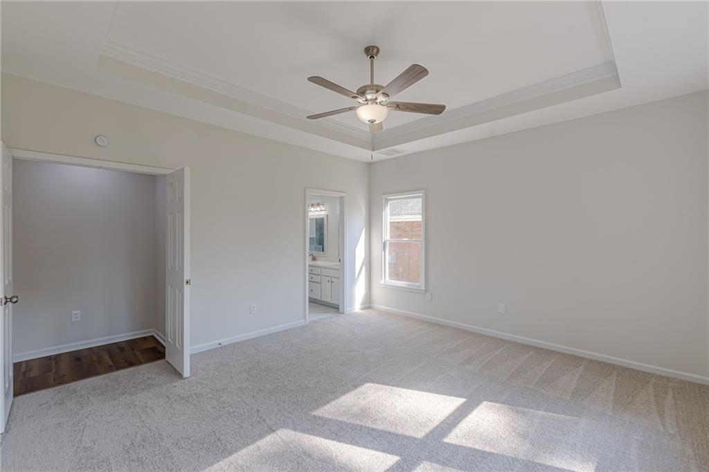 775 Southland Pass Stone Mountain, GA 30087 - Photo 29 of 76 a view of a livingroom with a ceiling fan and window