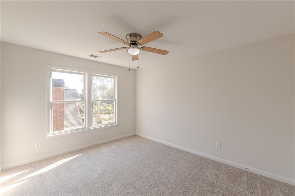 775 Southland Pass Stone Mountain, GA 30087 - Photo 46 of 76 an empty room with a window and a fan