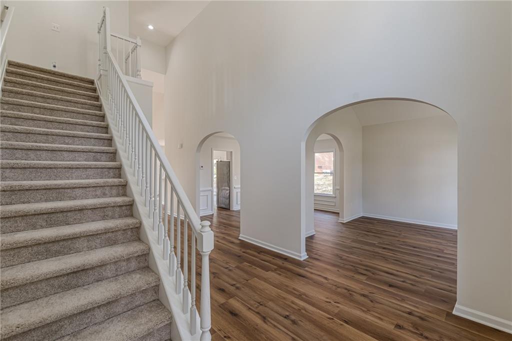 775 Southland Pass Stone Mountain, GA 30087 - Photo 5 of 76 a view of livingroom with wooden floor and stairs