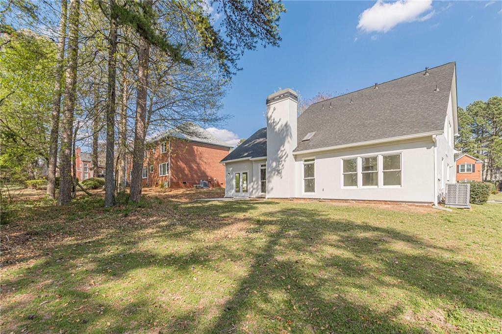 775 Southland Pass Stone Mountain, GA 30087 - Photo 51 of 76 a front view of a house with a garden