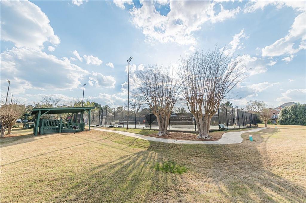 775 Southland Pass Stone Mountain, GA 30087 - Photo 61 of 76 a view of a yard with trees in the background