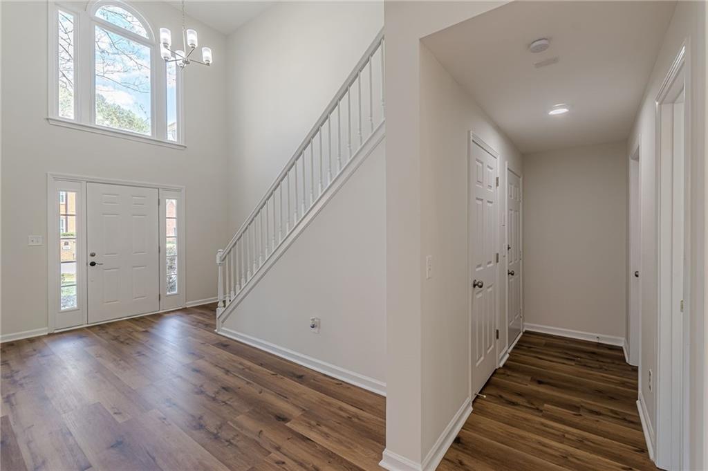 775 Southland Pass Stone Mountain, GA 30087 - Photo 8 of 76 a view of a hallway with wooden floor and staircase